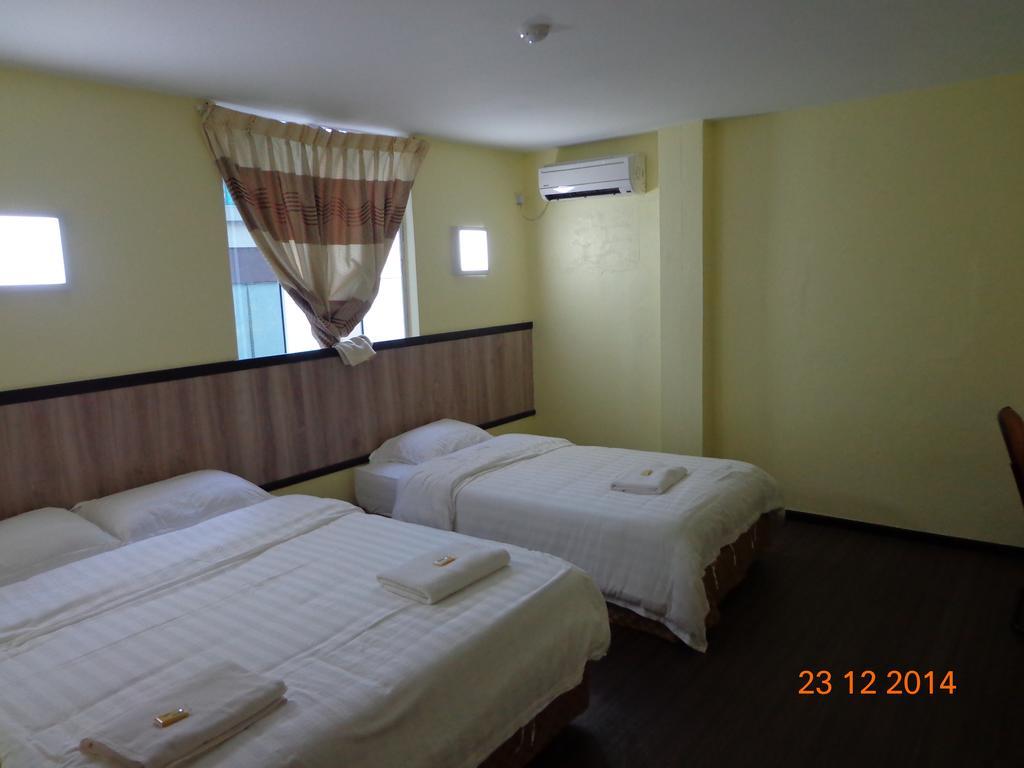 The Garden Inn Miri Szoba fotó