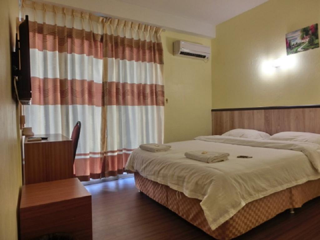 The Garden Inn Miri Szoba fotó